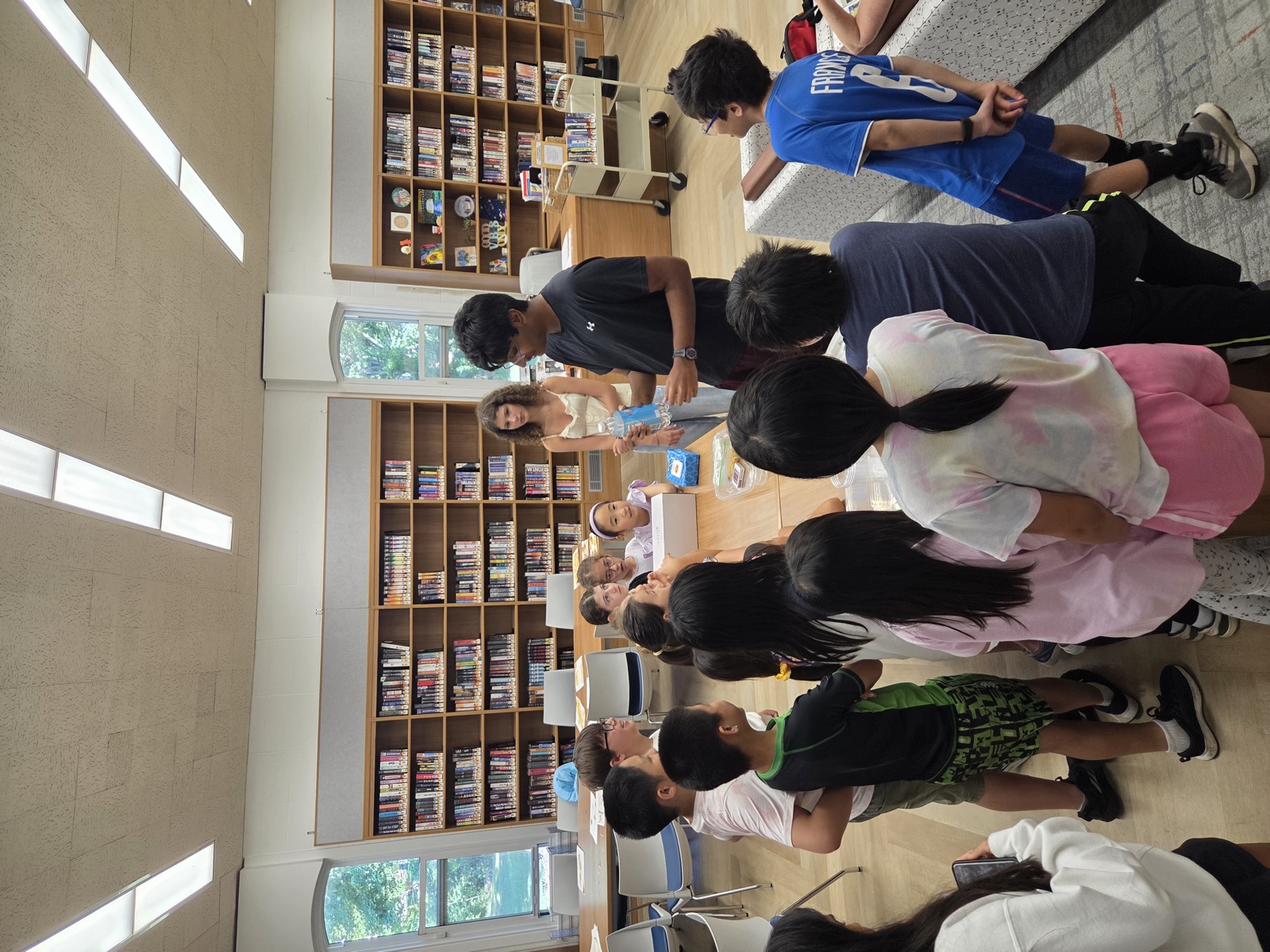 Instructor demonstrating the dancing raisins experiment to students